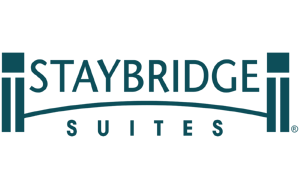 Staybridge Suites logo with teal text and two square columns connected by a curved line.